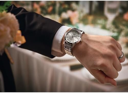 CITIZEN Men's Eco-Drive Dress Classic Watch, Silver-Tone Stainless Steel Bracelet, Ivory Dial, 3 Hand, Day/Date (Model: AW0100-86B)